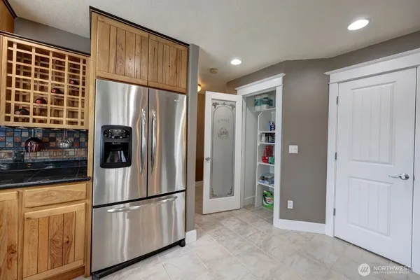 a white refrigerator freezer and a refrigerator