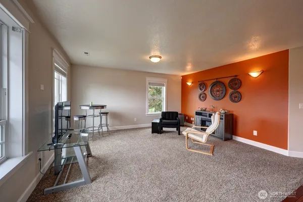 a living room with furniture and white walls