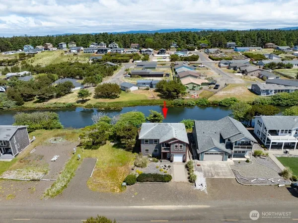 an aerial view of residential houses with outdoor space