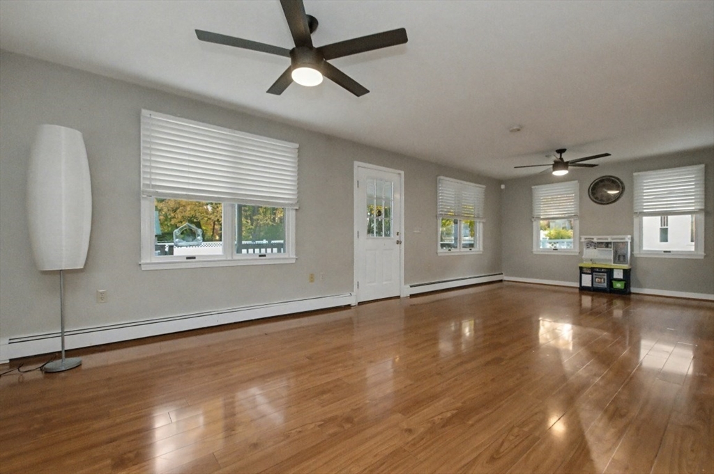 48 Cordis Street Wakefield, MA 01880 - Photo 14 of 35 a view of an empty room with window and wooden floor