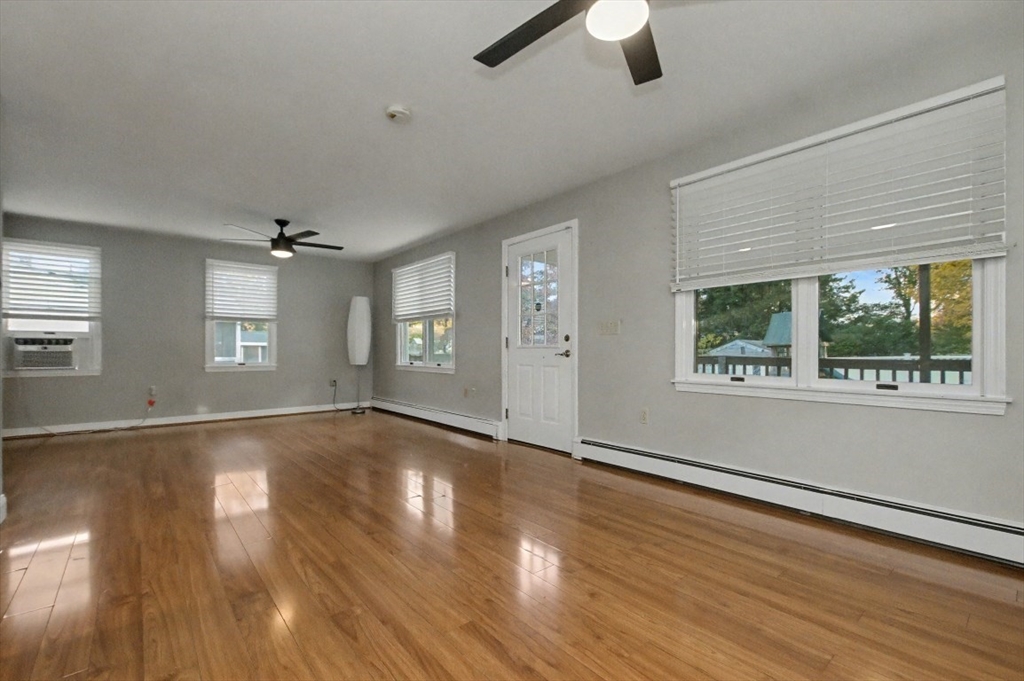 48 Cordis Street Wakefield, MA 01880 - Photo 15 of 35 an empty room with wooden floor and windows