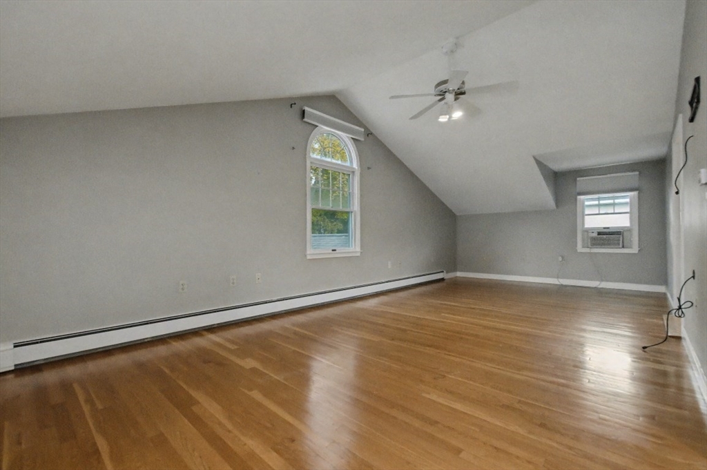48 Cordis Street Wakefield, MA 01880 - Photo 16 of 35 wooden floor in an empty room with a window