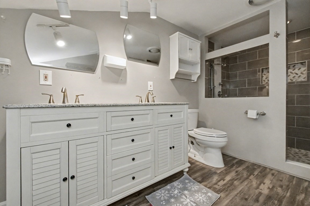 48 Cordis Street Wakefield, MA 01880 - Photo 18 of 35 a bathroom with a toilet sink and mirror