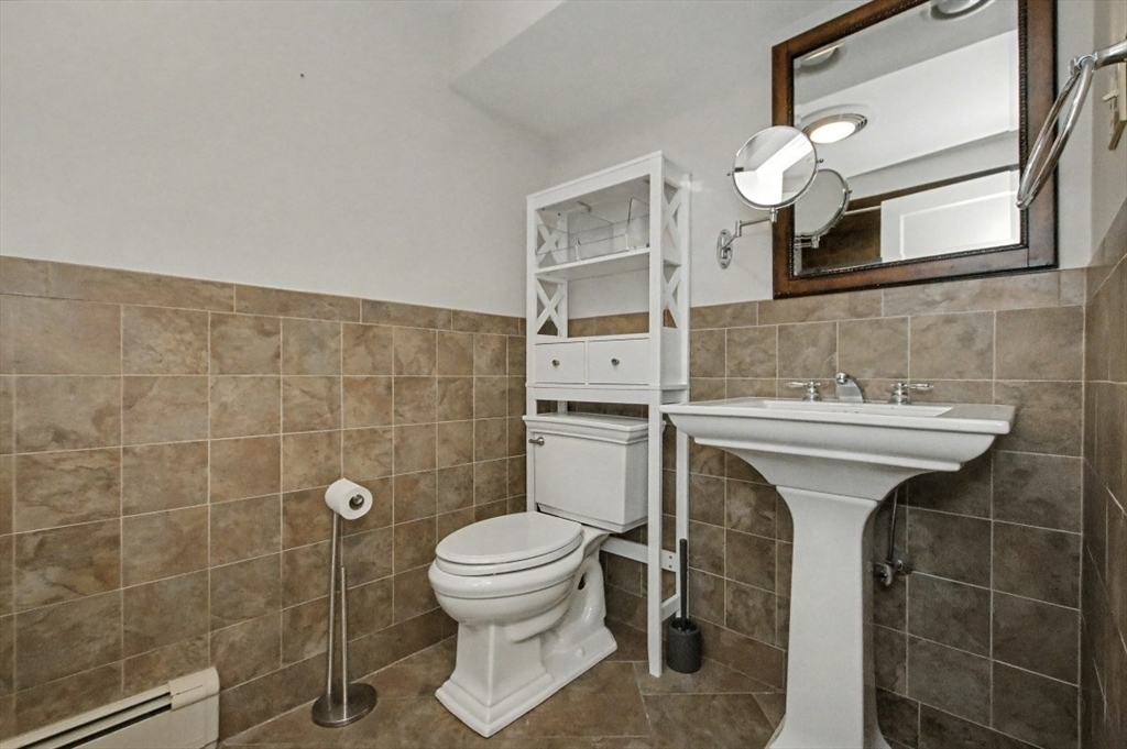 48 Cordis Street Wakefield, MA 01880 - Photo 19 of 35 a bathroom with a sink toilet and shower