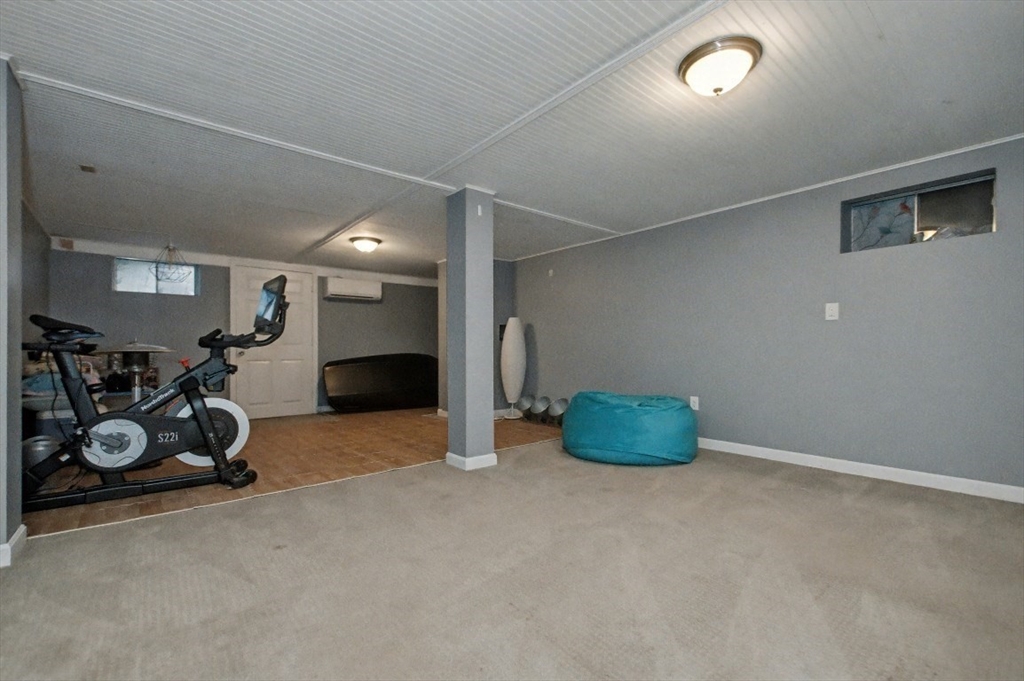 48 Cordis Street Wakefield, MA 01880 - Photo 31 of 35 a room with gym equipment and a table
