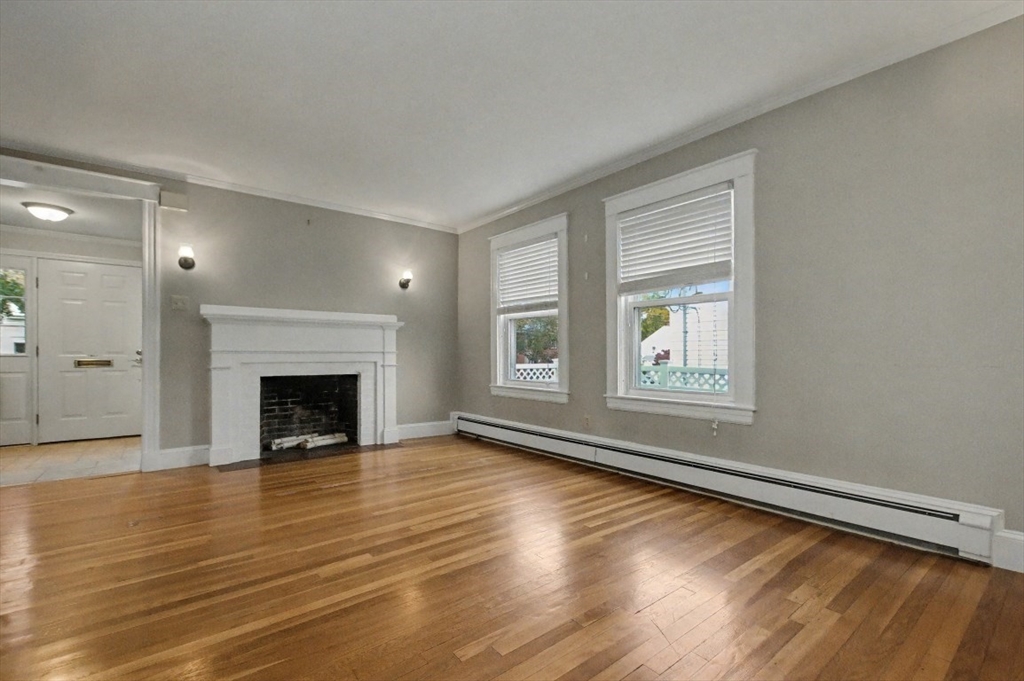 48 Cordis Street Wakefield, MA 01880 - Photo 5 of 35 wooden floor fireplace and windows in an empty room