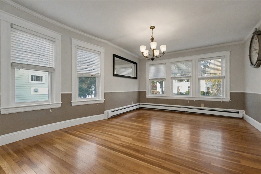 48 Cordis Street Wakefield, MA 01880 - Photo 7 of 35 a view of empty room with wooden floor and window