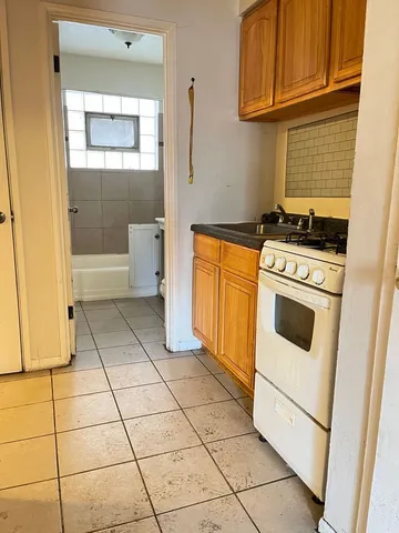 a kitchen with a stove a washer and dryer