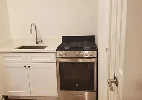 a close view of a stove in the bathroom