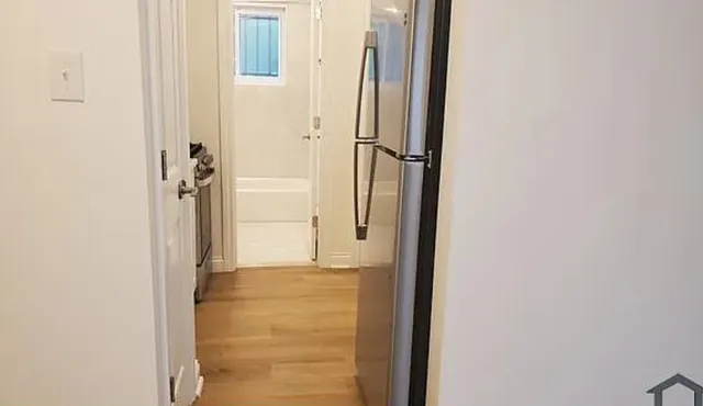 a bathroom with a glass door shower