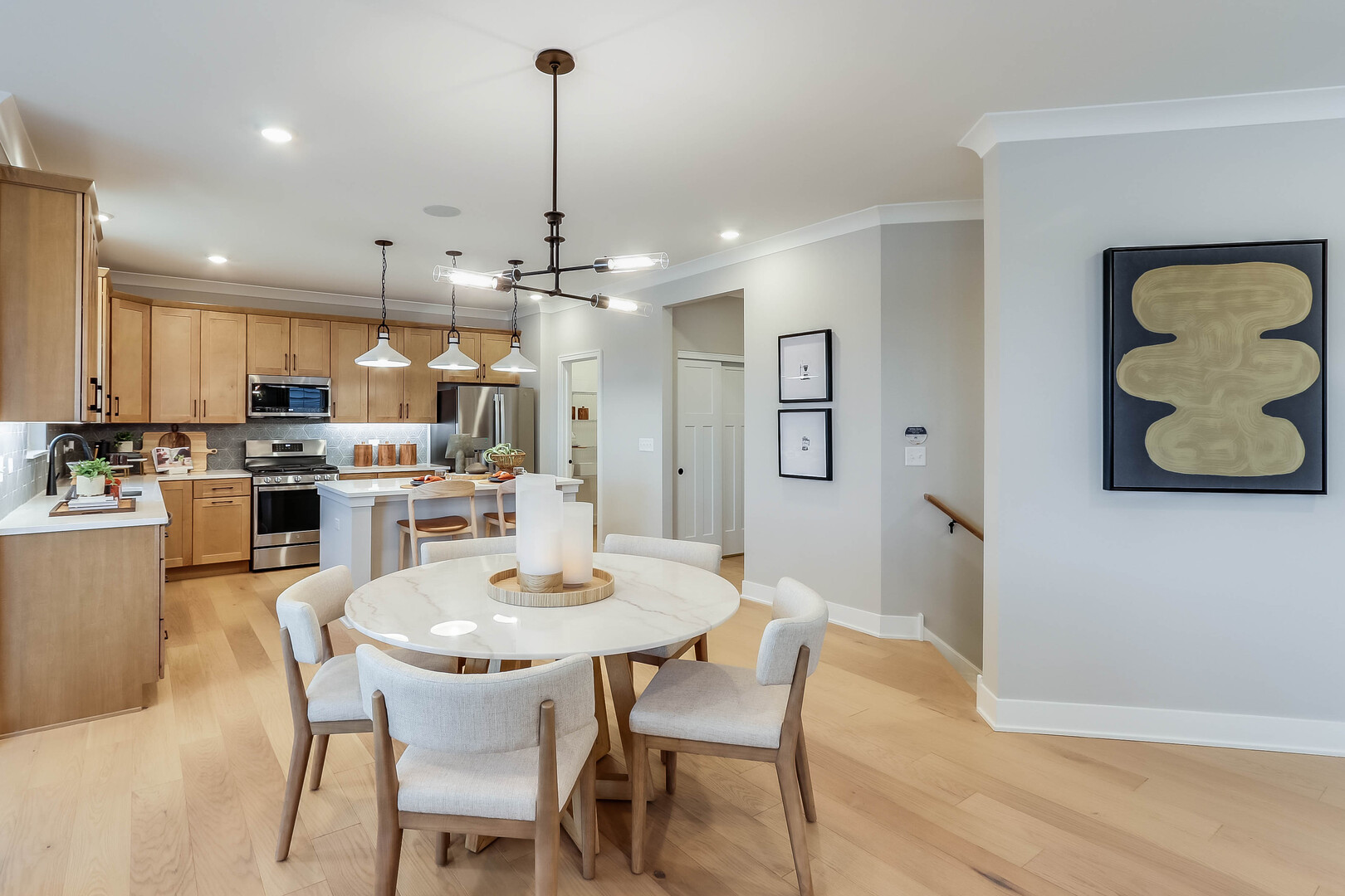 10772 Chadsey Road Huntley, IL 60142 - Photo 11 of 29 a kitchen with a dining table chairs and view of living room