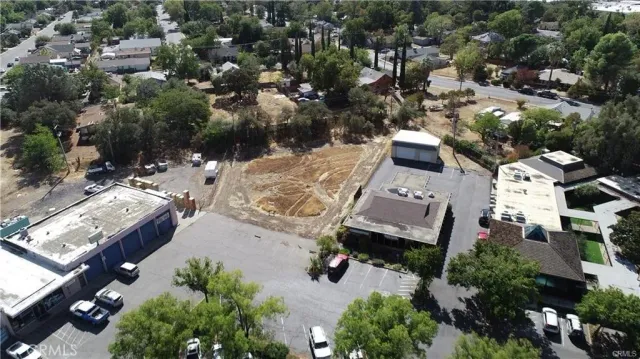 an aerial view of a house with a yard