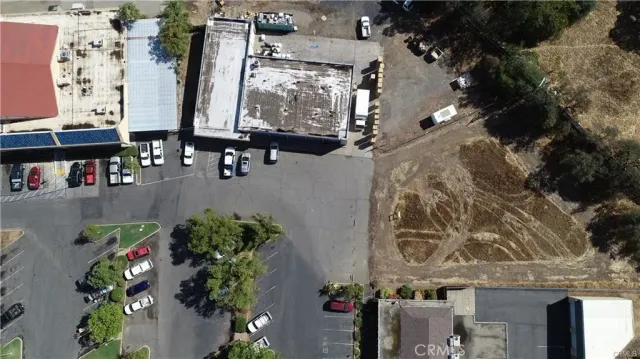 an aerial view of multi story residential apartment building with yard