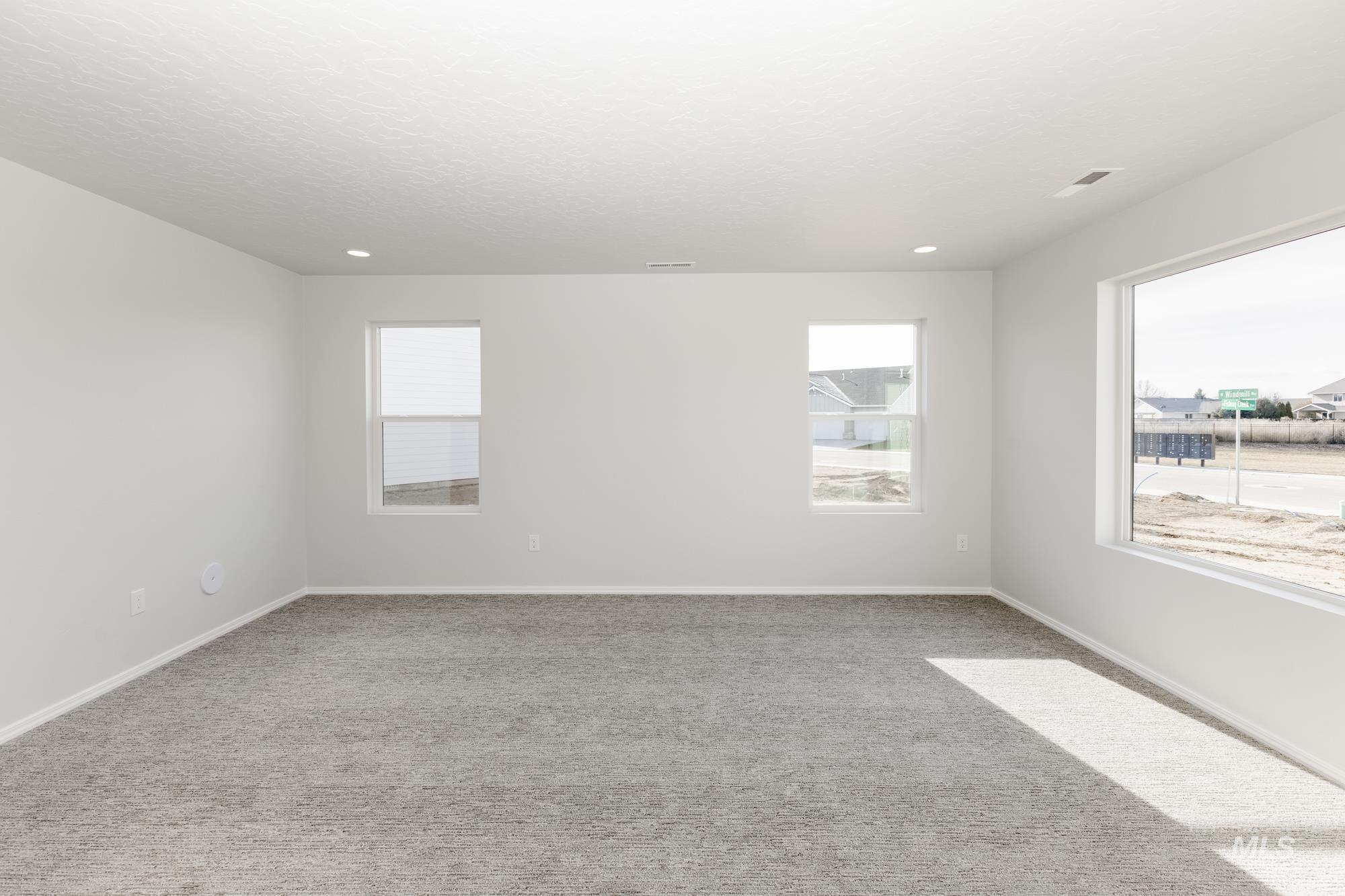 3070 South Maple Rnch Way Nampa, ID 83686 - Photo 11 of 33 Spare room featuring light colored carpet