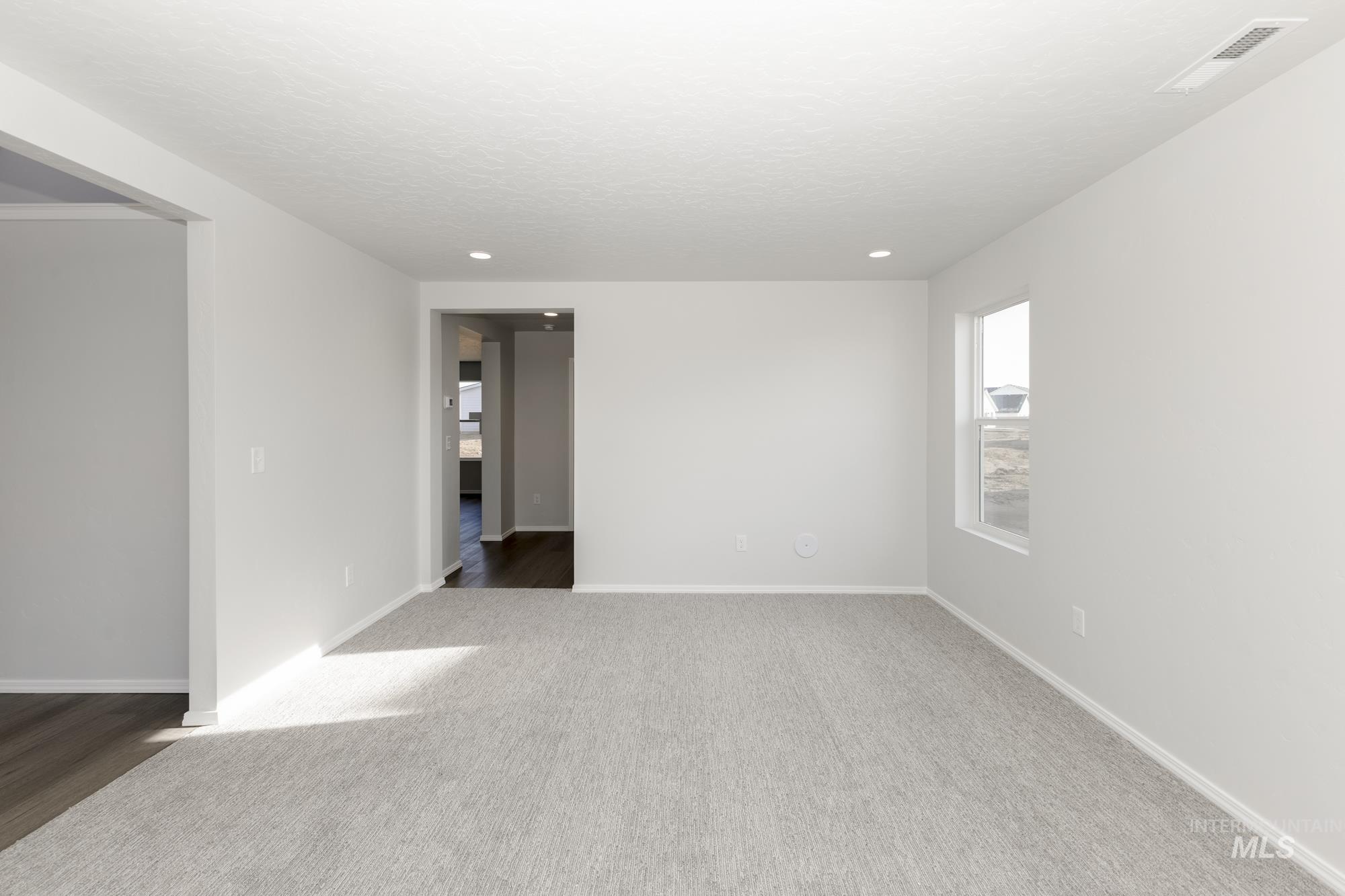3070 South Maple Rnch Way Nampa, ID 83686 - Photo 13 of 33 Empty room with baseboards and carpet floors
