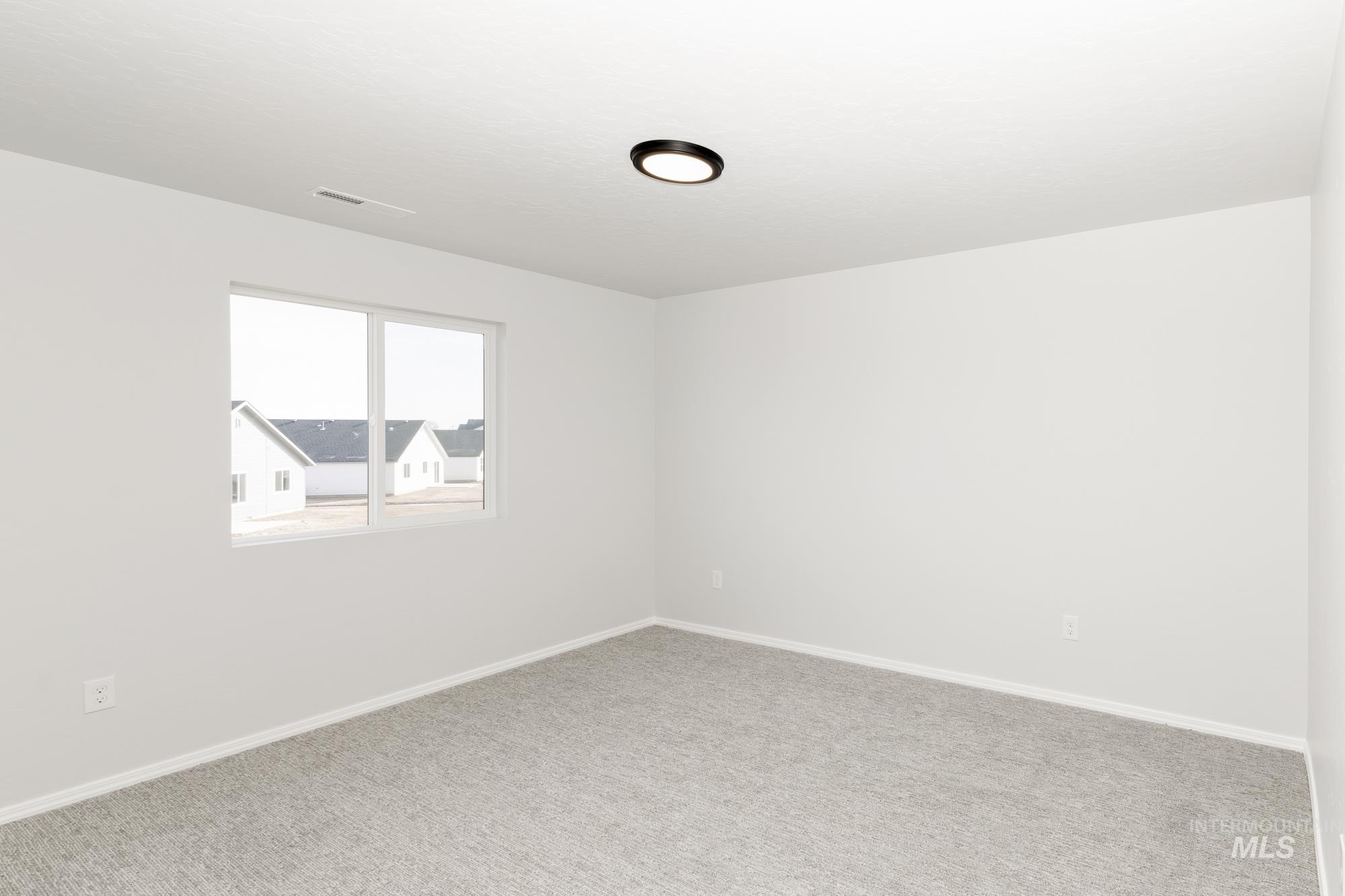 3070 South Maple Rnch Way Nampa, ID 83686 - Photo 22 of 33 Carpeted empty room with baseboards