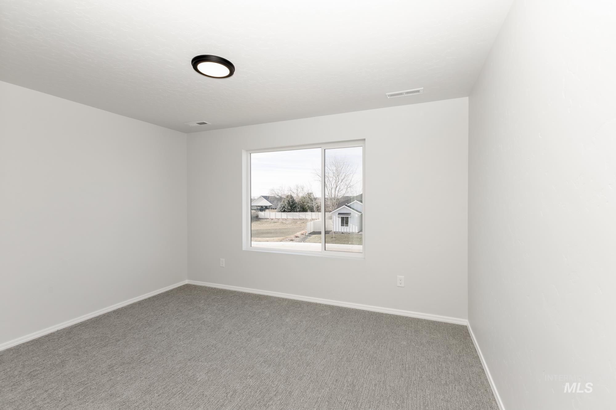 3070 South Maple Rnch Way Nampa, ID 83686 - Photo 23 of 33 Carpeted empty room with baseboards
