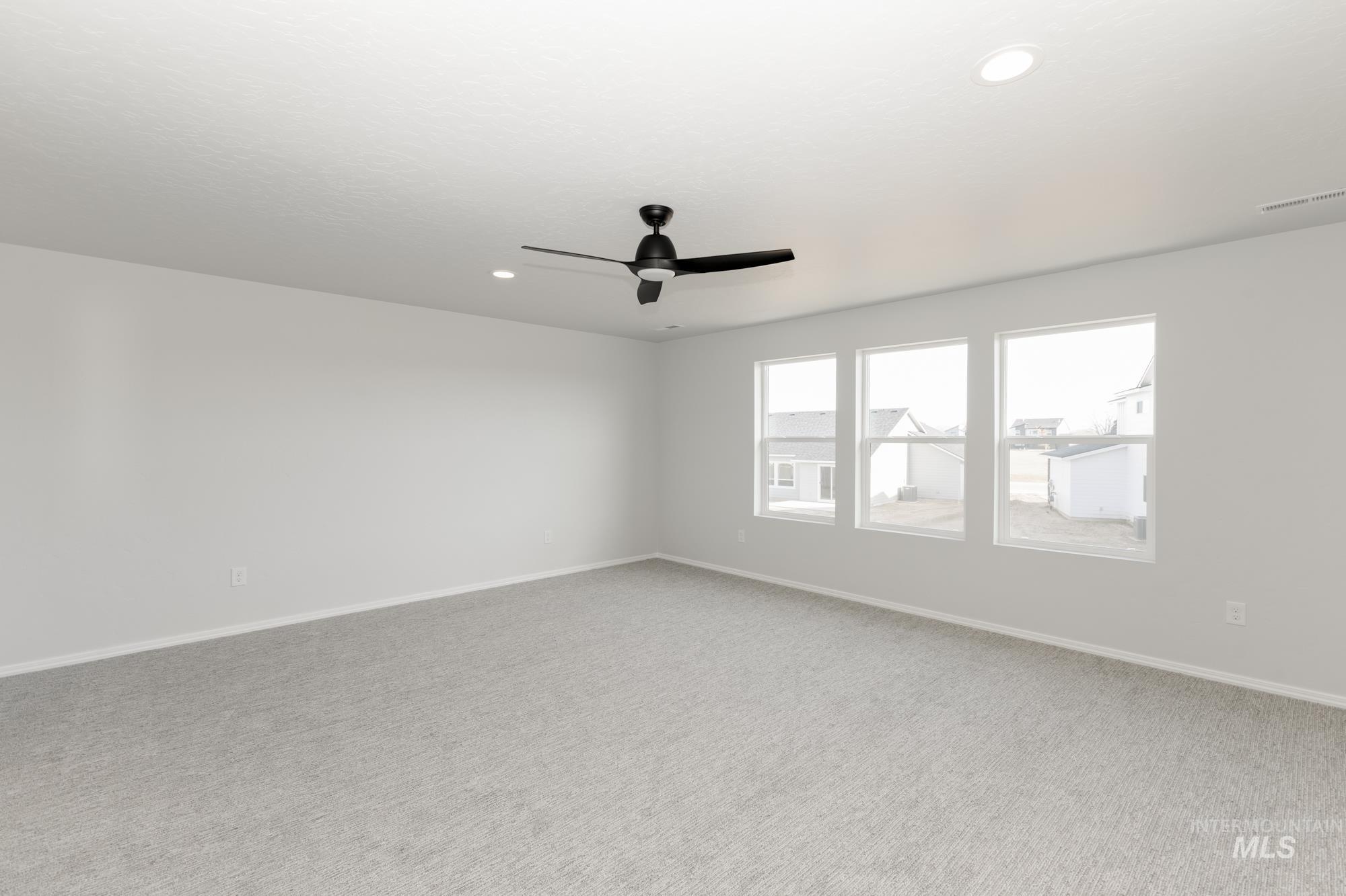 3070 South Maple Rnch Way Nampa, ID 83686 - Photo 26 of 33 Carpeted empty room featuring recessed lighting and a ceiling fan