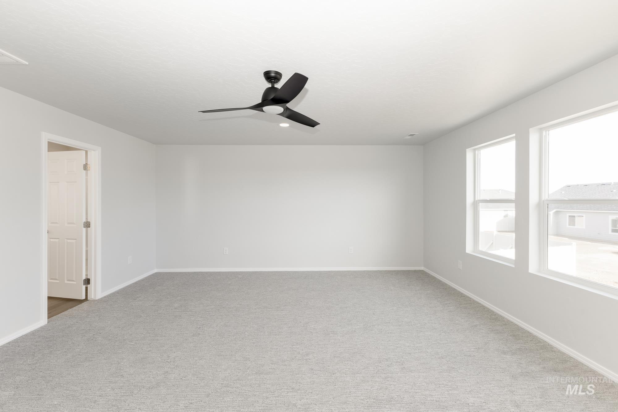 3070 South Maple Rnch Way Nampa, ID 83686 - Photo 27 of 33 Spare room with carpet flooring and ceiling fan