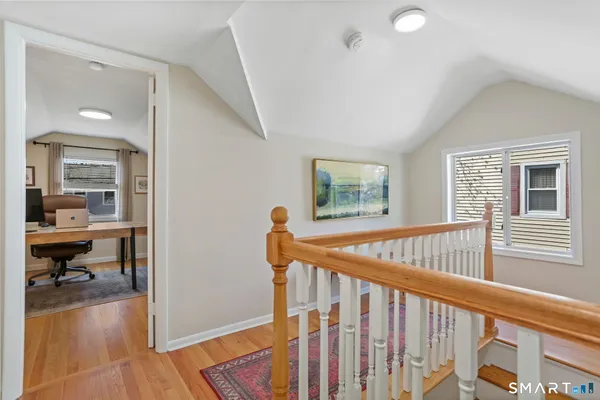 a view of livingroom with furniture and workspace