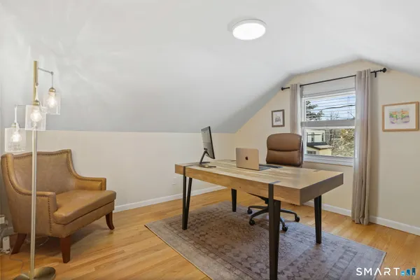 a view of a workspace with furniture