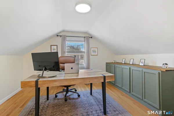 a view of a workspace with furniture