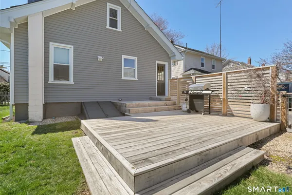 a patio with table and chairs