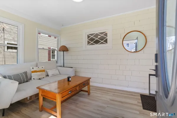 a living room with couch and a window