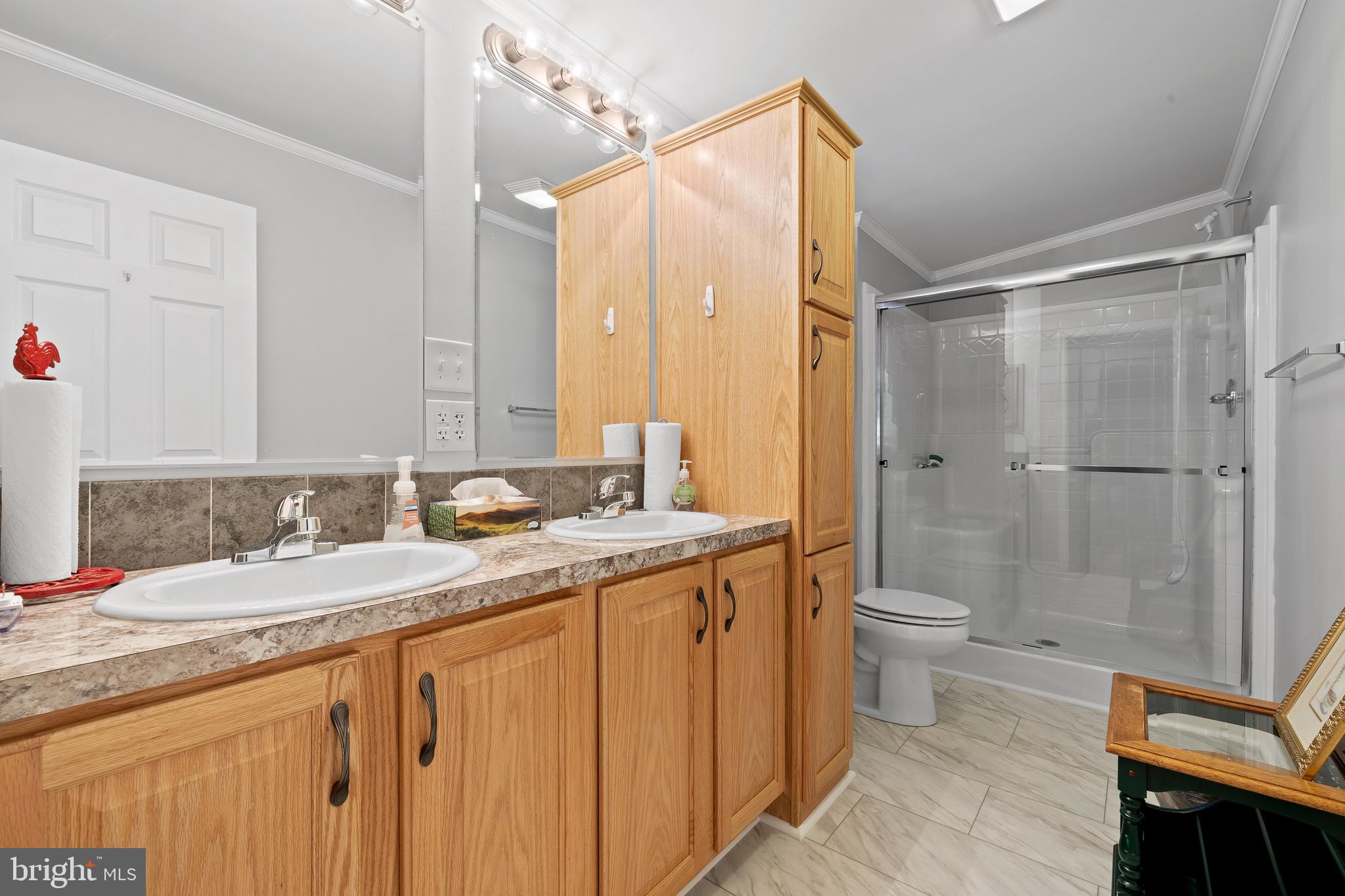 74 Middlemarch Road Douglassville, PA 19518 - Photo 8 of 26 a bathroom with a granite countertop sink toilet and shower