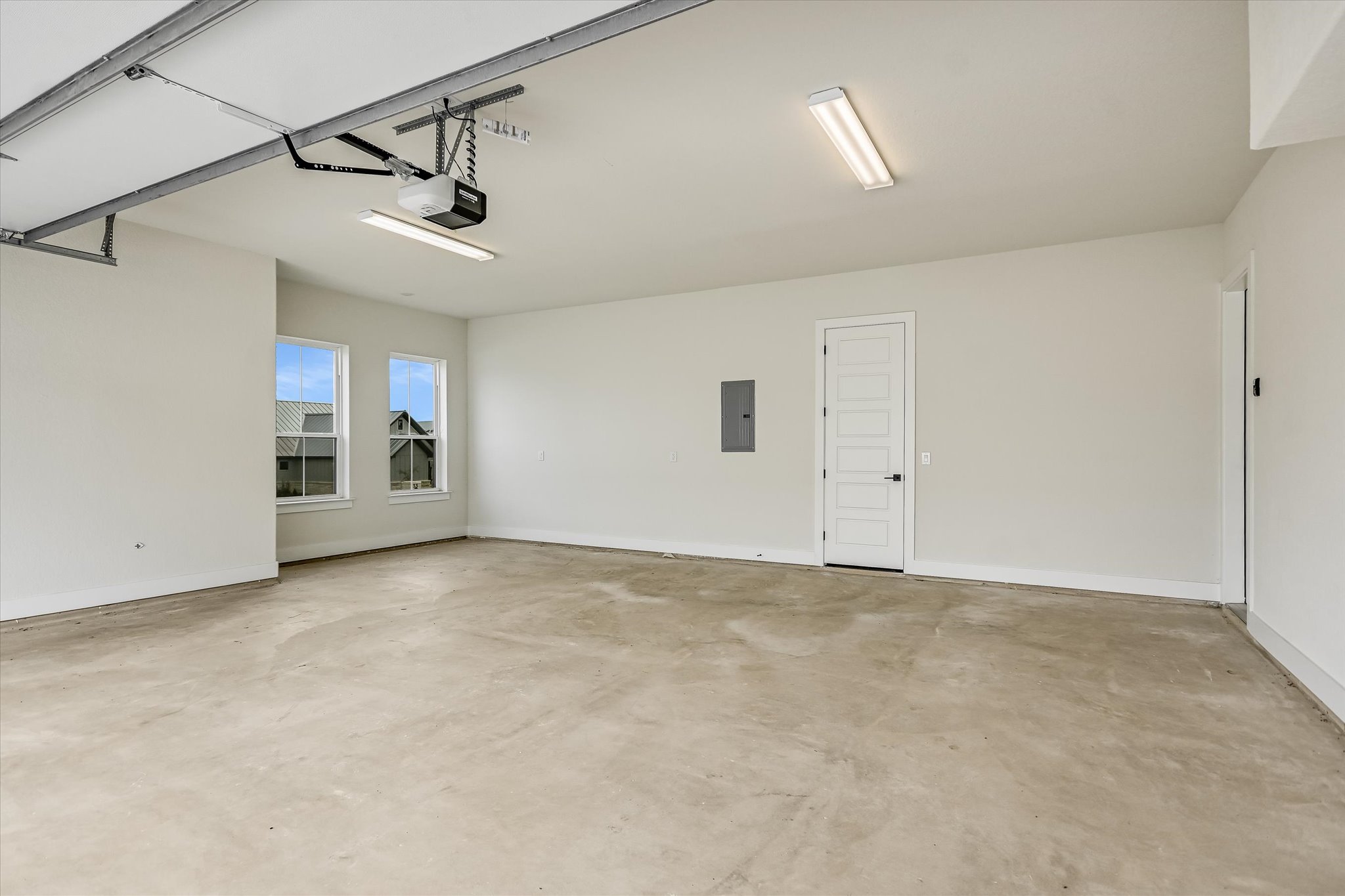 32 Peace Pipe Wimberley, TX 78676 - Photo 20 of 20 Garage featuring electric panel and a garage door opener