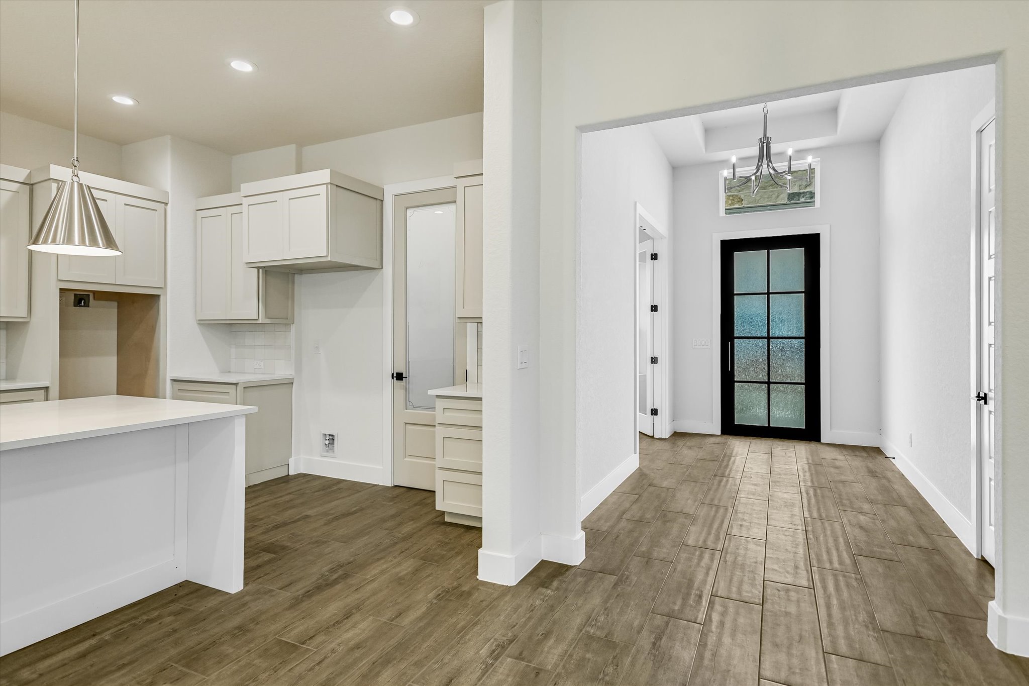 32 Peace Pipe Wimberley, TX 78676 - Photo 3 of 20 Entryway with dark wood-style flooring and hanging lights