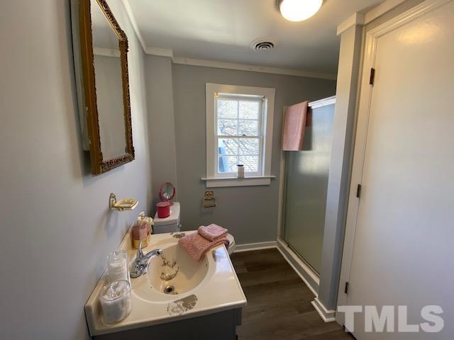 107 North 12th Street Erwin, NC 28339 - Photo 12 of 23 a bathroom with a sink and a mirror