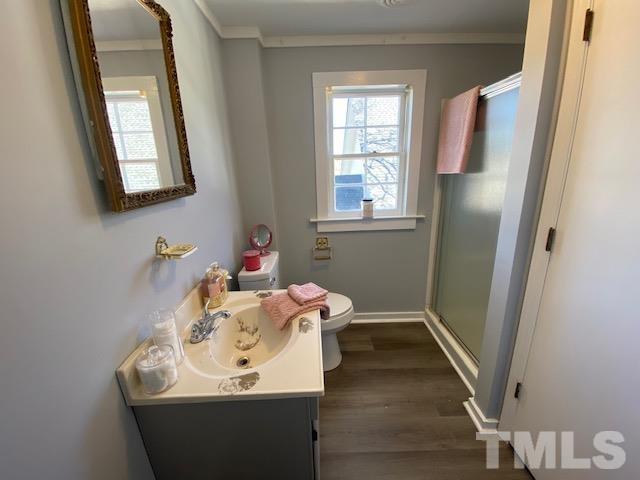 107 North 12th Street Erwin, NC 28339 - Photo 13 of 23 a bathroom with a sink and a mirror