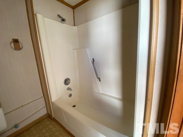 107 North 12th Street Erwin, NC 28339 - Photo 16 of 23 a bathroom with a tub and a shower