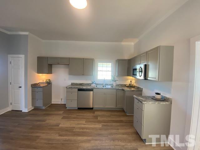 107 North 12th Street Erwin, NC 28339 - Photo 3 of 23 a kitchen with granite countertop a sink and steel appliances