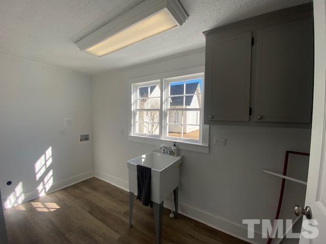 107 North 12th Street Erwin, NC 28339 - Photo 6 of 23 a workspace with wooden floor and a window