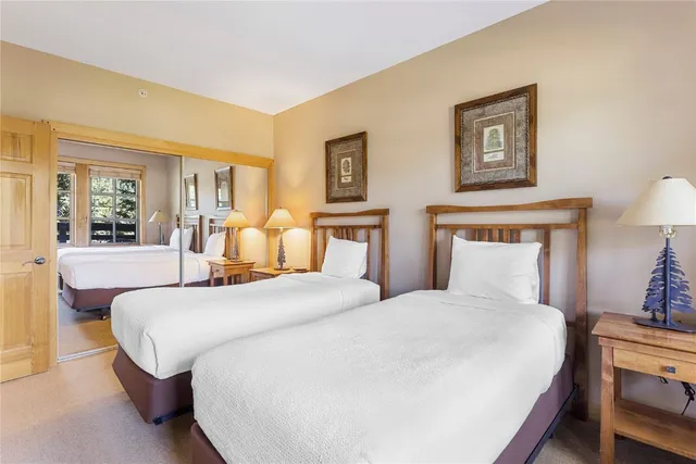 a bedroom with bed and window