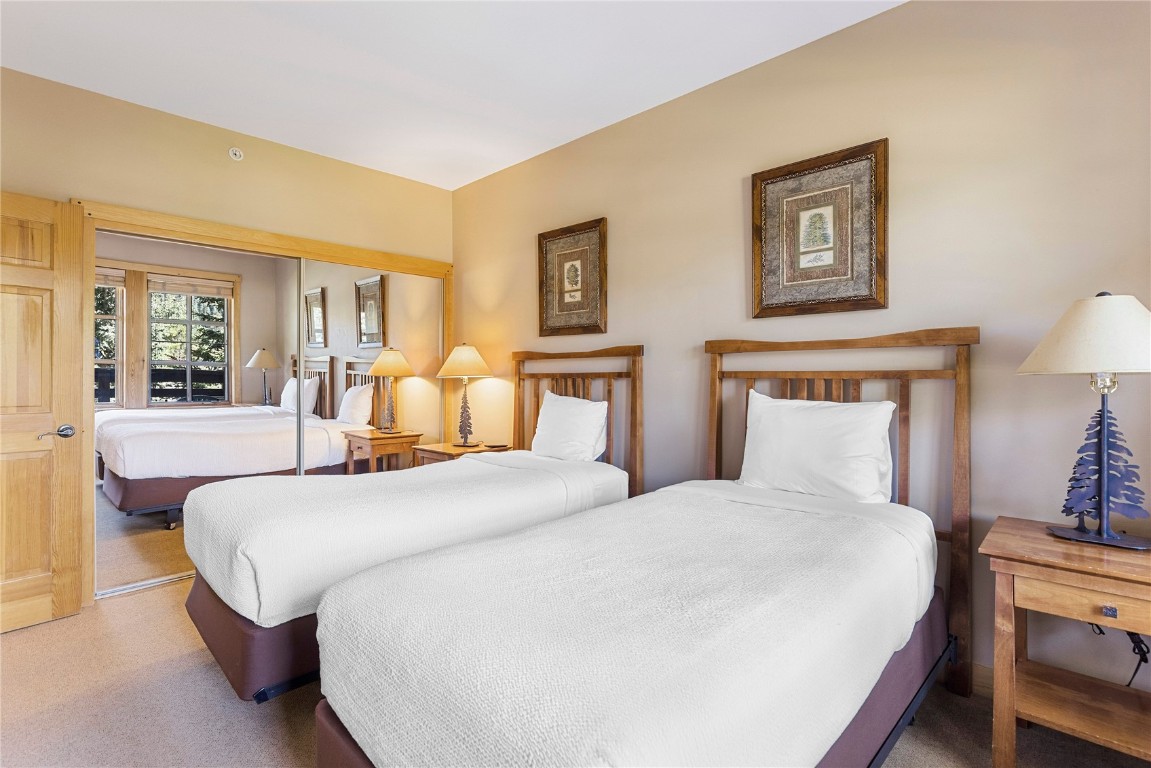 910 Copper Road, Unit 219 Copper Mountain, CO 80443 - Photo 21 of 33 a bedroom with bed and window