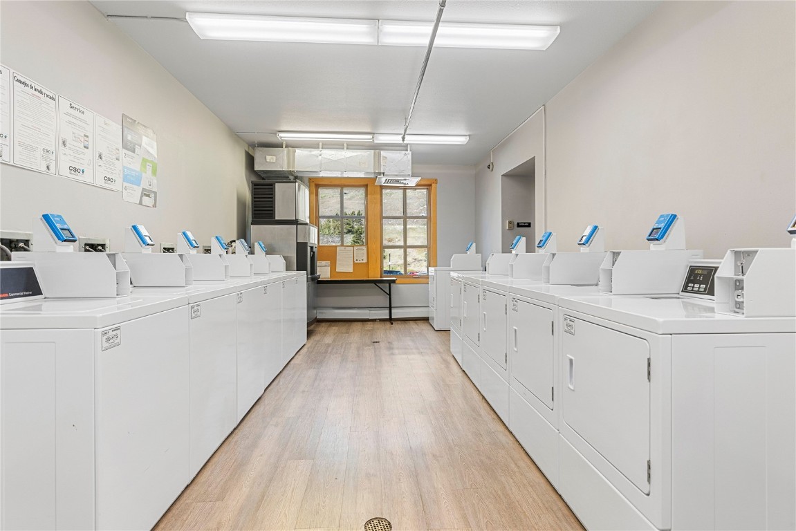 910 Copper Road, Unit 219 Copper Mountain, CO 80443 - Photo 27 of 33 a large white room with mirror and sink