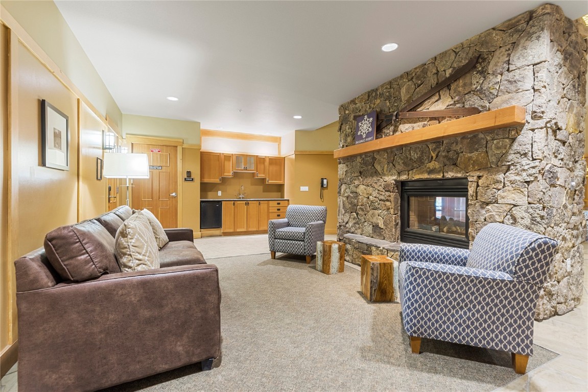 910 Copper Road, Unit 219 Copper Mountain, CO 80443 - Photo 31 of 33 a living room with furniture and a fireplace