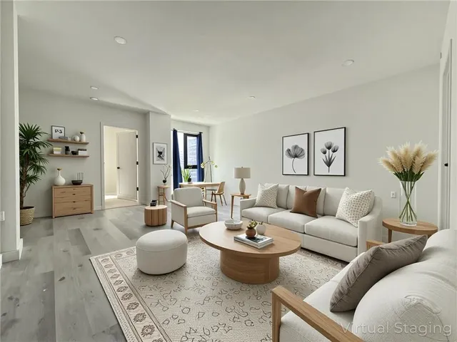 a living room with furniture and a table