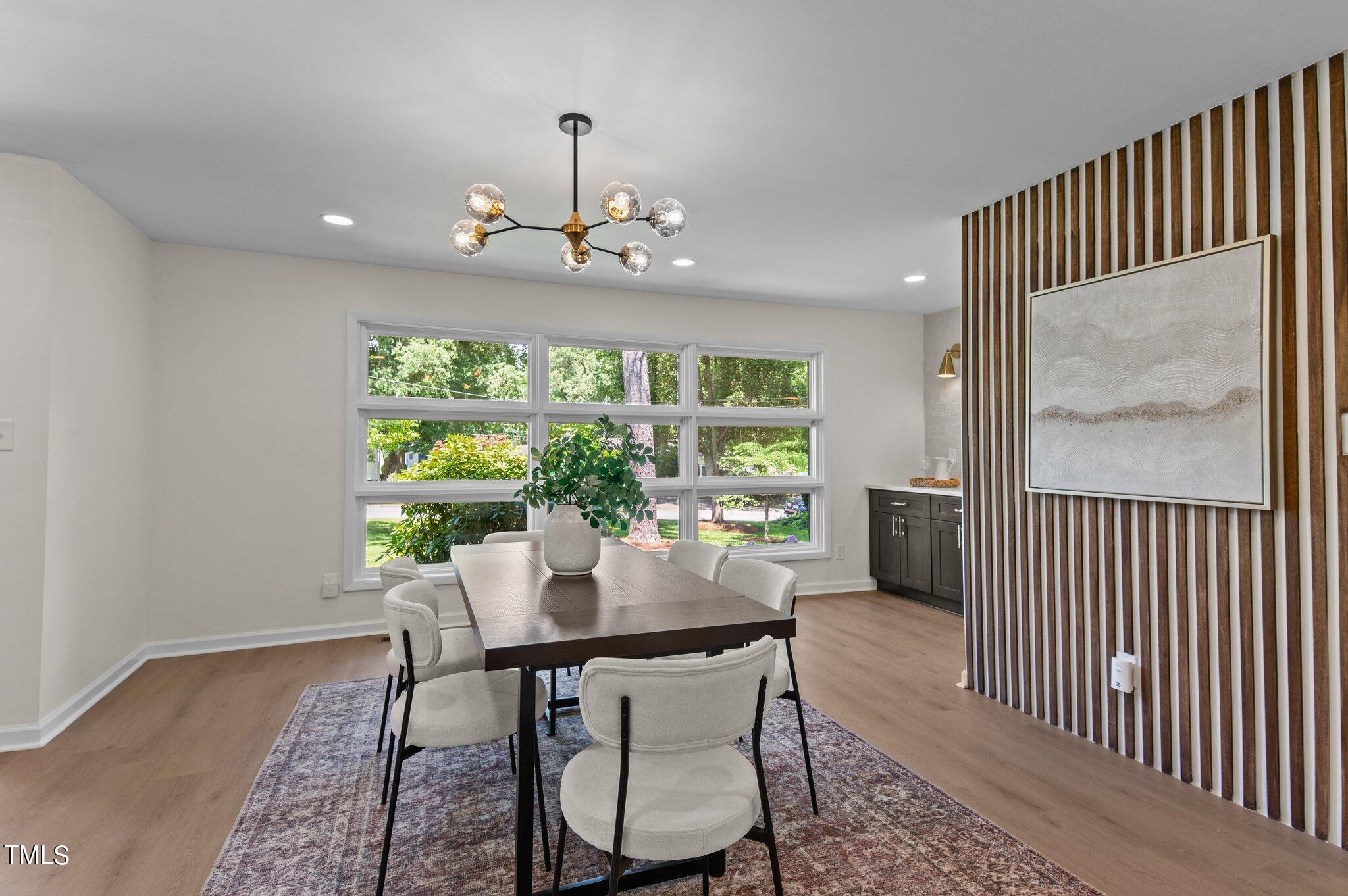 405 Roxanne Drive Raleigh, NC 27603 - Photo 19 of 48 a view of a dining room with furniture window and outside view