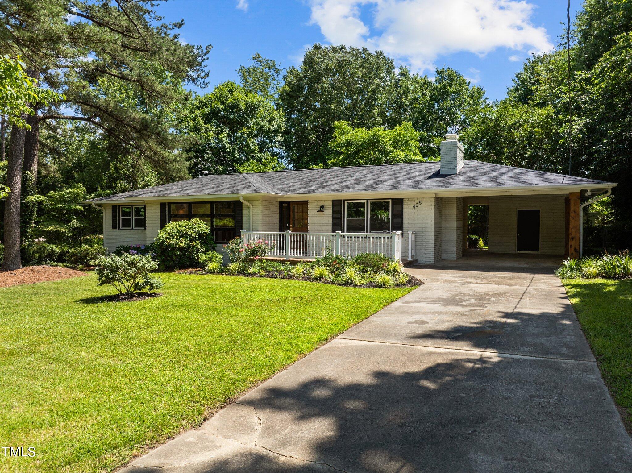 405 Roxanne Drive Raleigh, NC 27603 - Photo 2 of 48 a house with garden in front of it