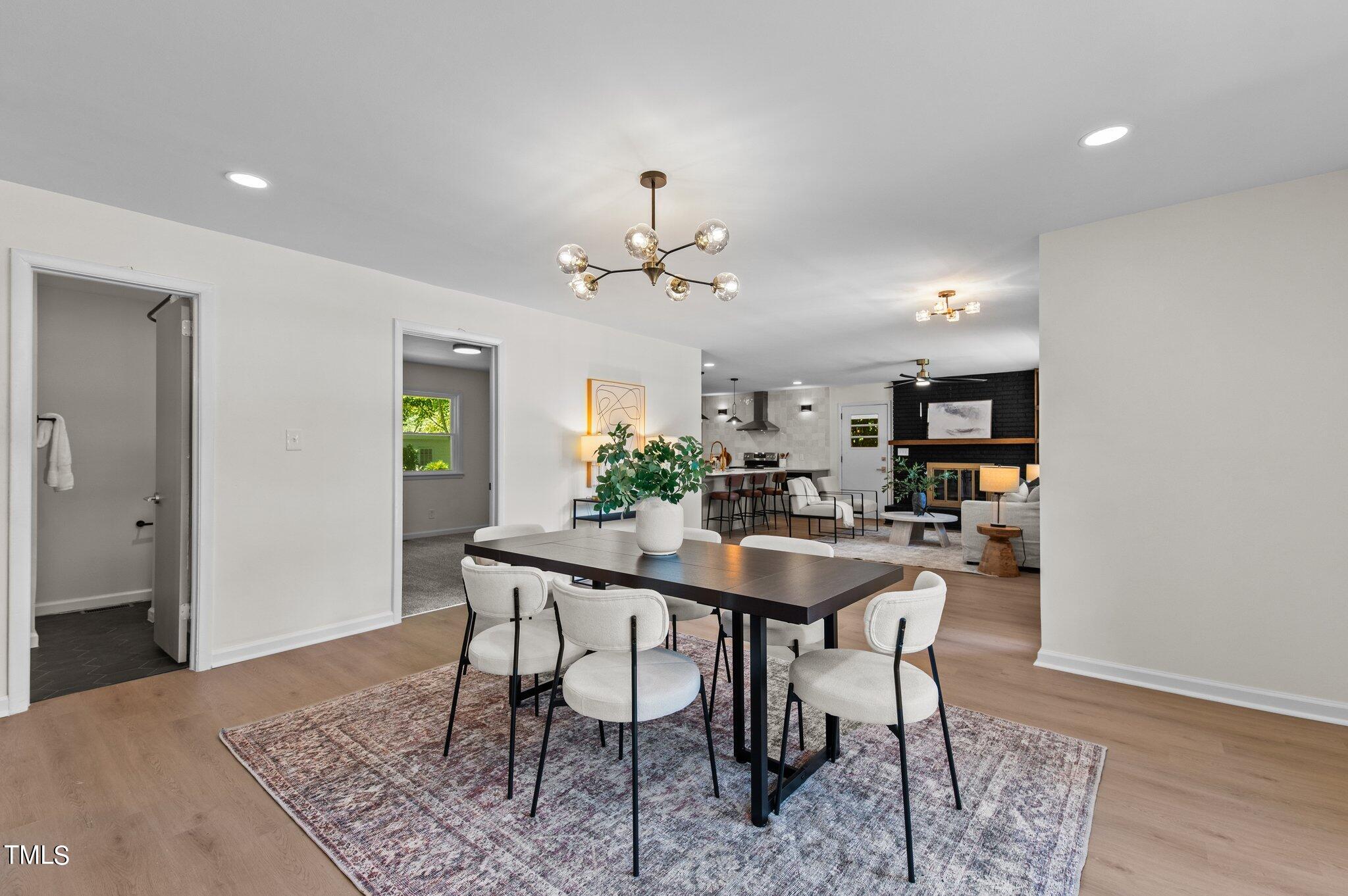 405 Roxanne Drive Raleigh, NC 27603 - Photo 21 of 48 a view of a dining room with furniture
