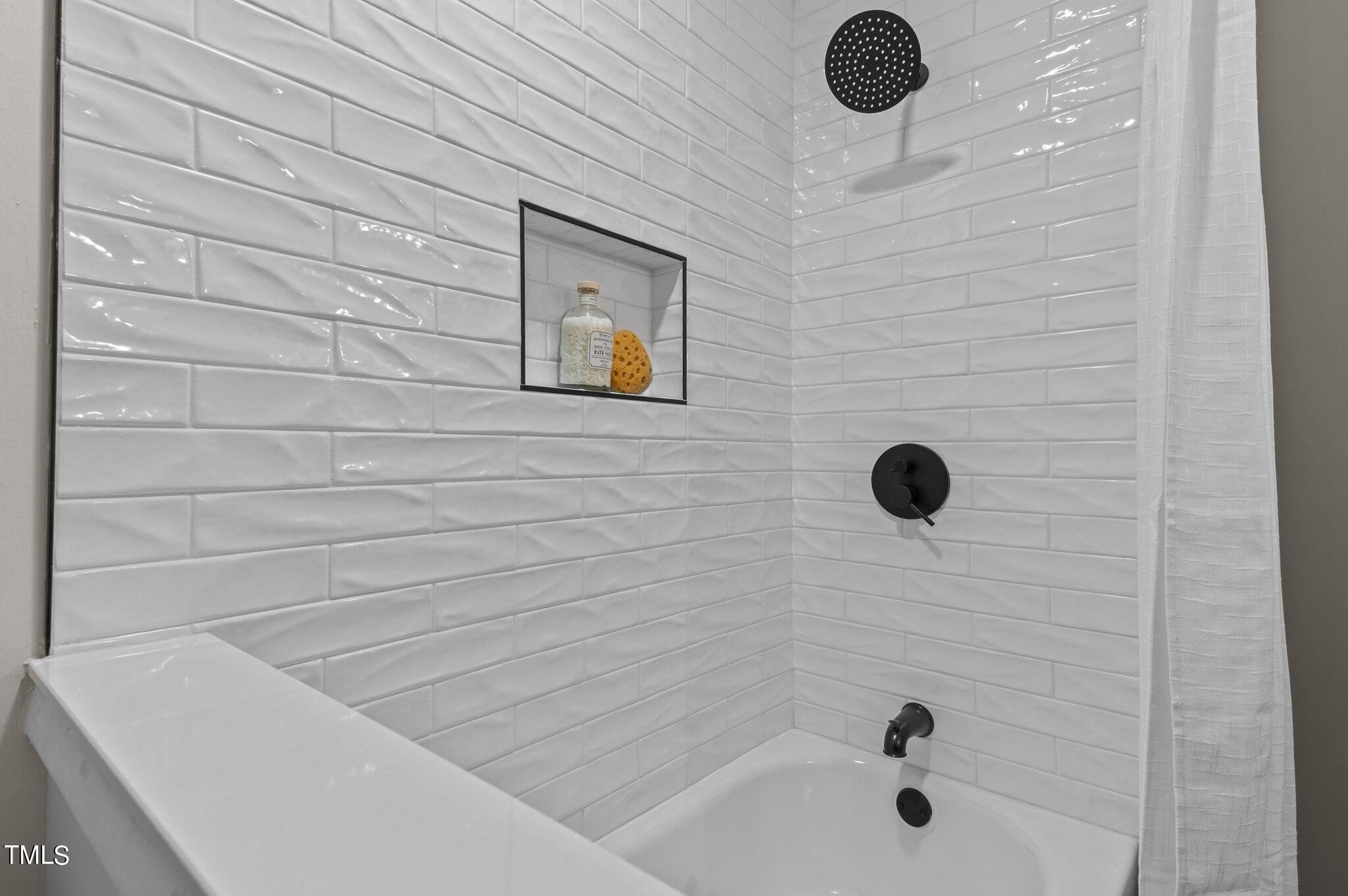 405 Roxanne Drive Raleigh, NC 27603 - Photo 24 of 48 a bathroom with a tub