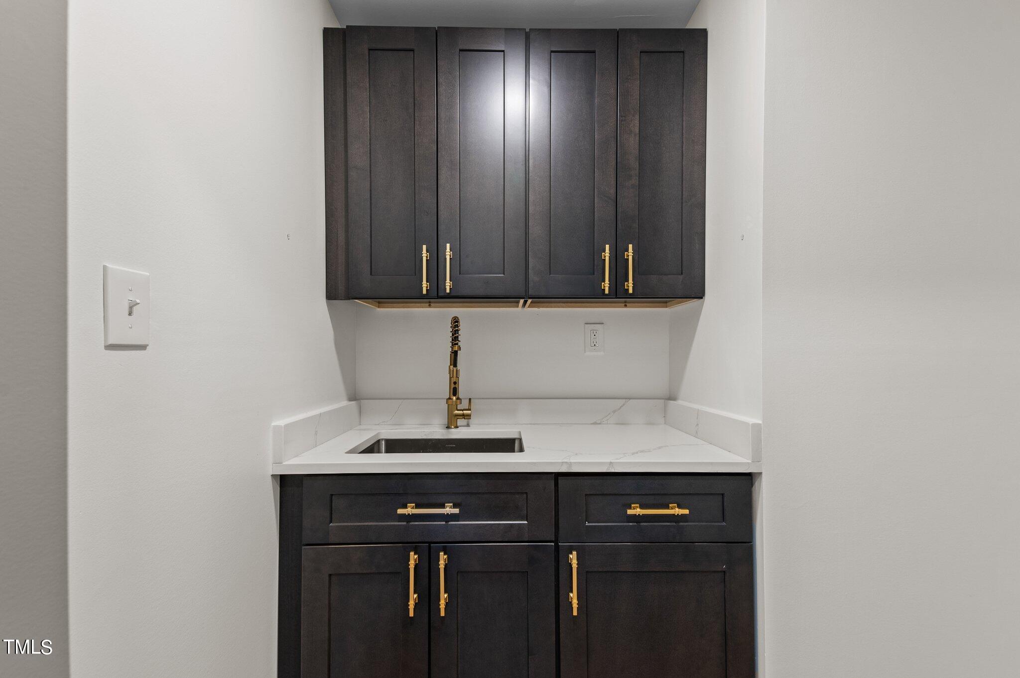 405 Roxanne Drive Raleigh, NC 27603 - Photo 27 of 48 a view of kitchen with a sink and cabinets