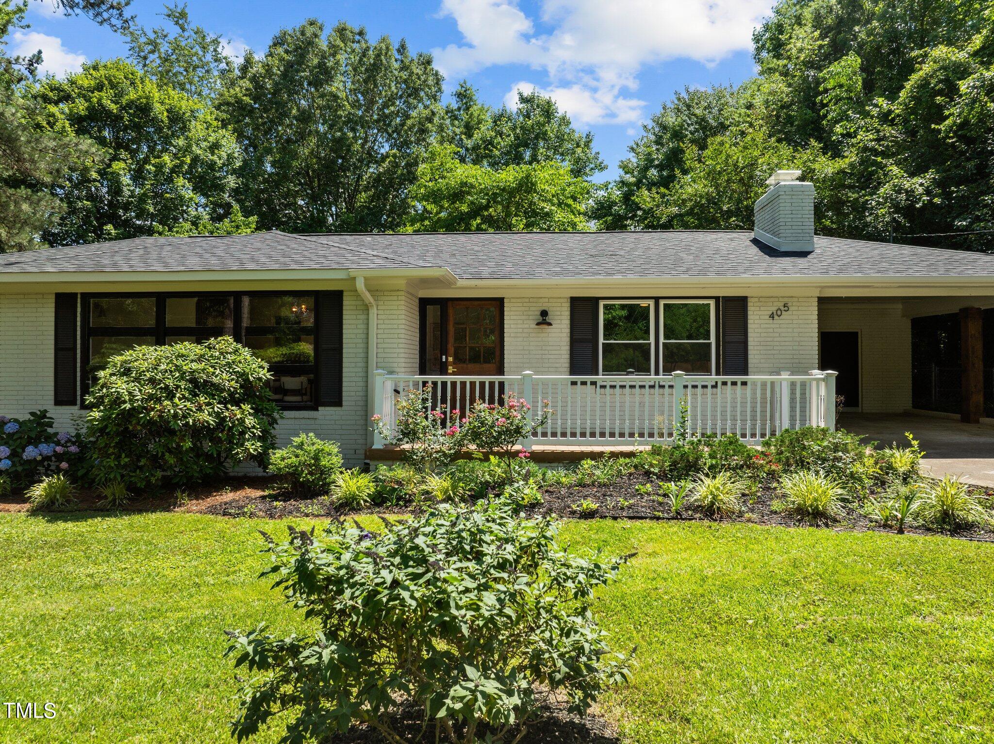 405 Roxanne Drive Raleigh, NC 27603 - Photo 4 of 48 front view of a house with a yard
