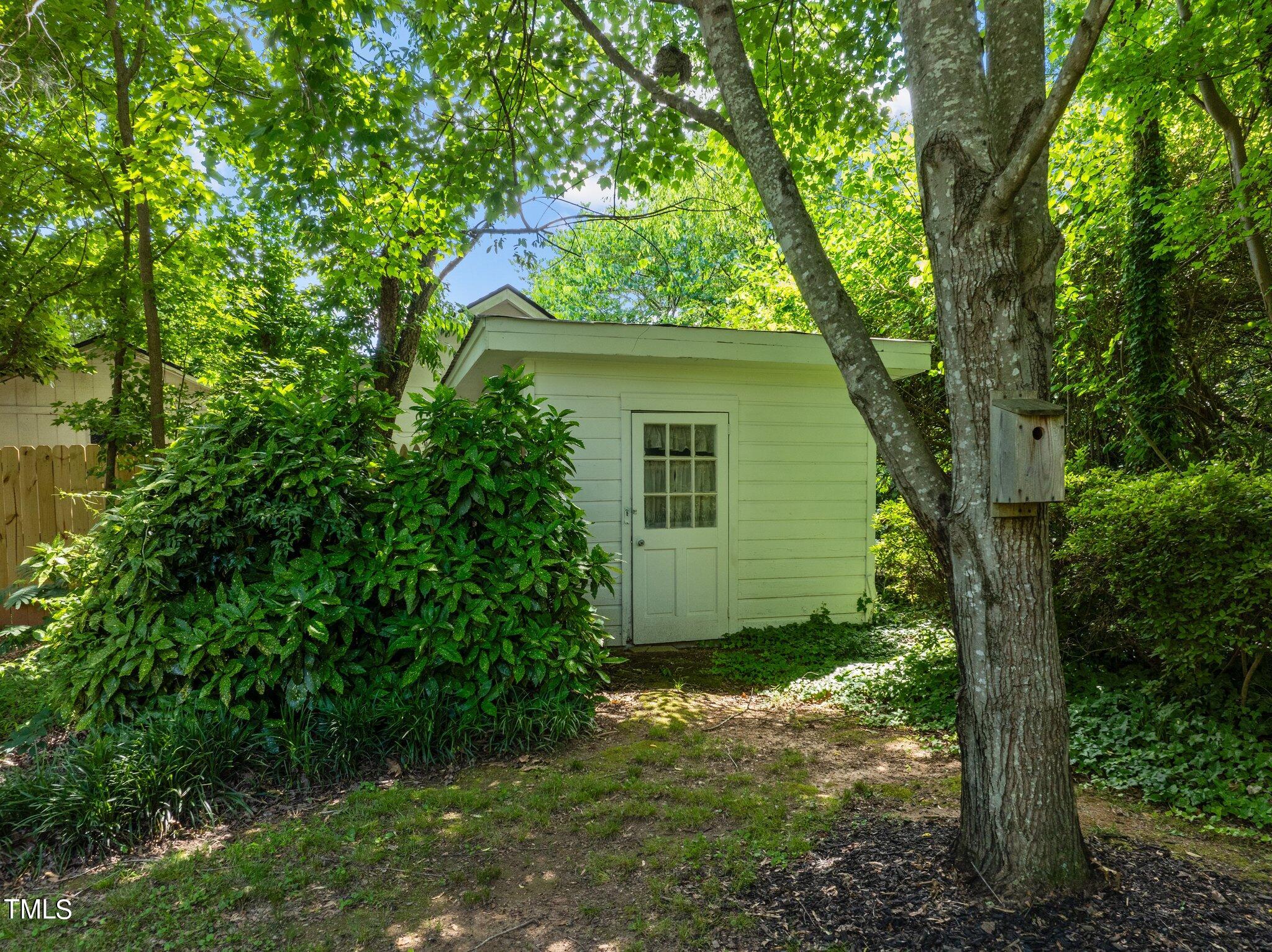 405 Roxanne Drive Raleigh, NC 27603 - Photo 42 of 48 a view of a house with a tree