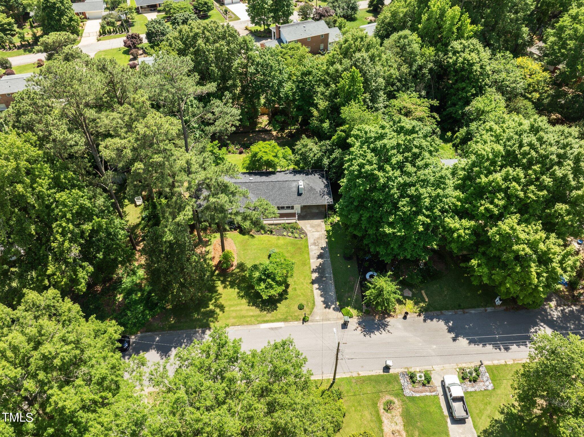 405 Roxanne Drive Raleigh, NC 27603 - Photo 46 of 48 an aerial view of residential house with outdoor space and trees all around