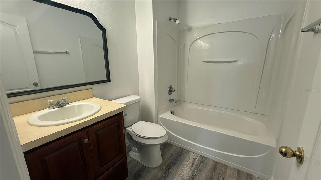 4484 Philadelphia Circle Kissimmee, FL 34746 - Photo 19 of 56 a bathroom with a sink toilet and shower